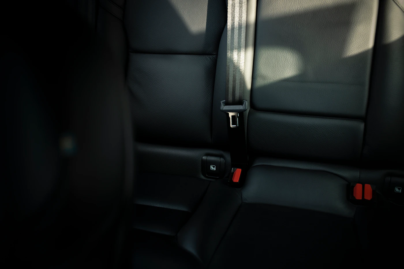 Empty back seat of a car, where Ohio booster seat laws require children to ride in the right restraint