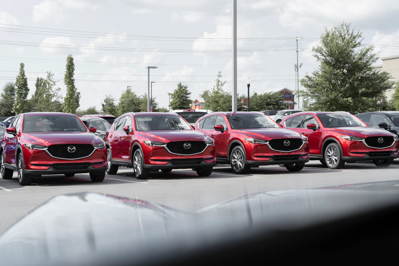 Rows of cars on a lot, illustrating the lemon law in Ohio for new and used vehicles